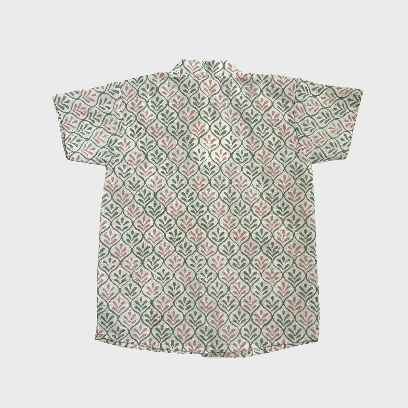 Back view of pink and green leaf motif batik shirt on cotton dobby