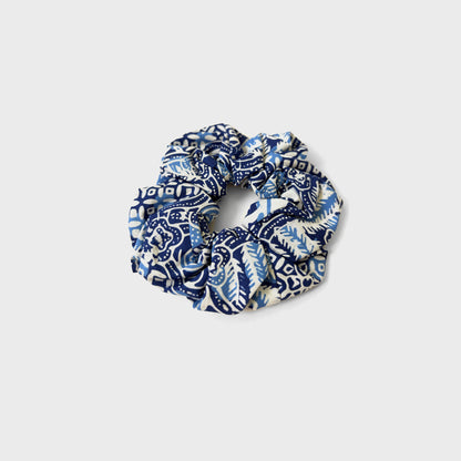 Blue batik fabric scrunchie with traditional patterns