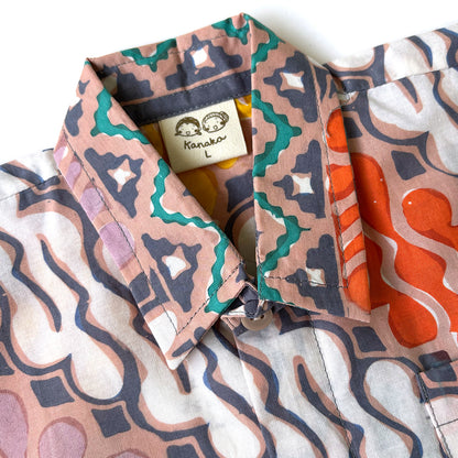 Close up of a handstamped batik shirt collar and fabric in a parang motif