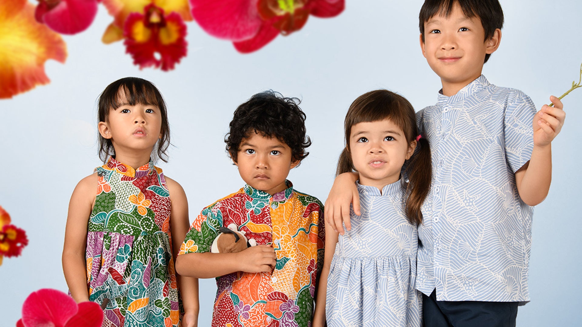 Kids wearing festive batik outfits