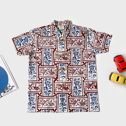 Flat lay of the chinoiserie motif batik shirt with mandarin collar and frog buttons 