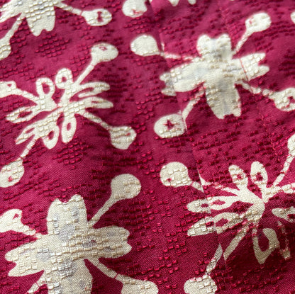 Close up of gold batik and cotton texture