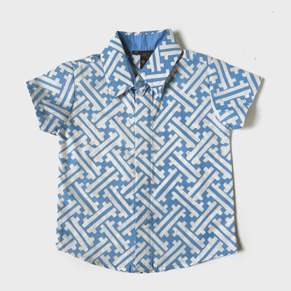 Flat lay of a light blue and white batik shirt with a lattice motif