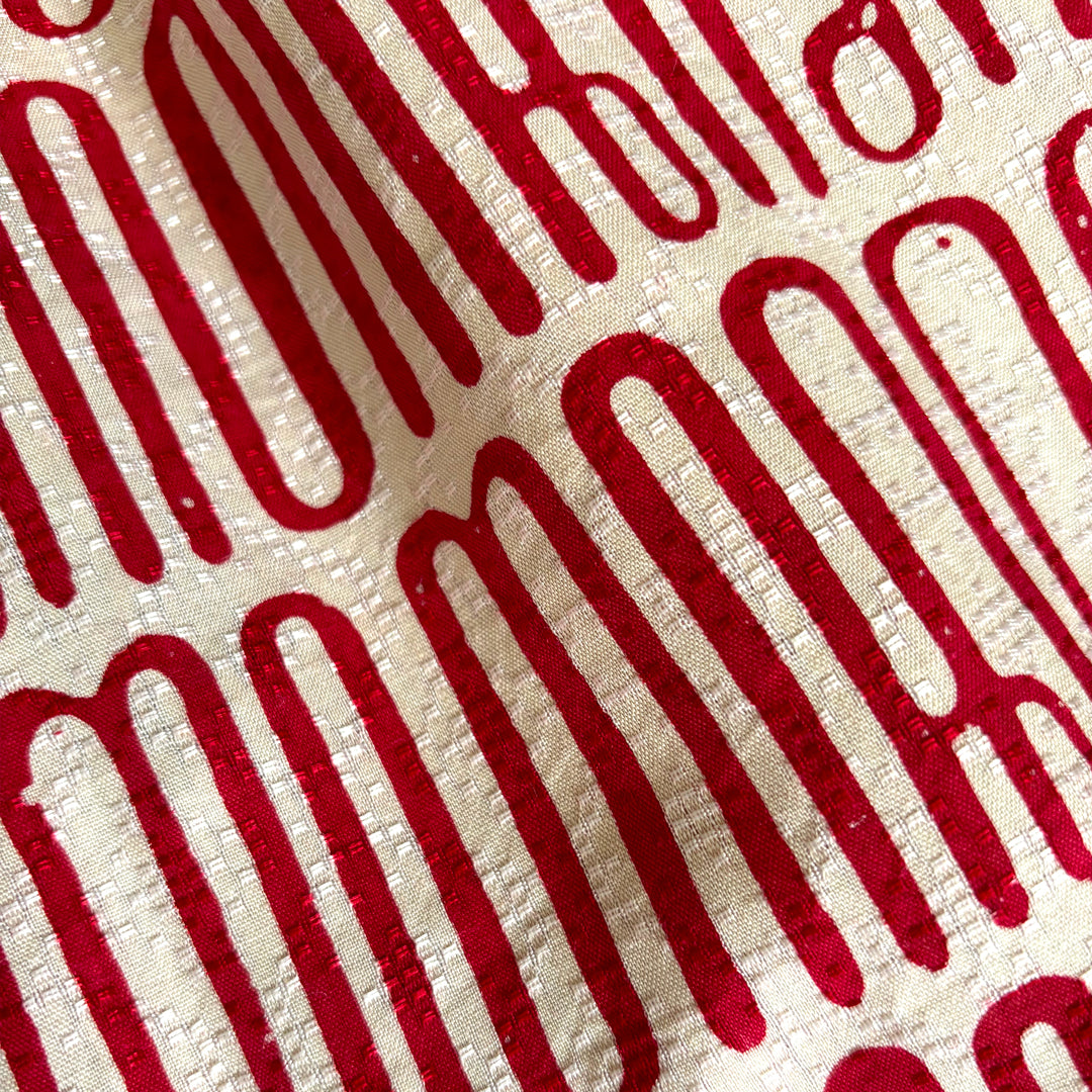 Close up of red and white batik dress