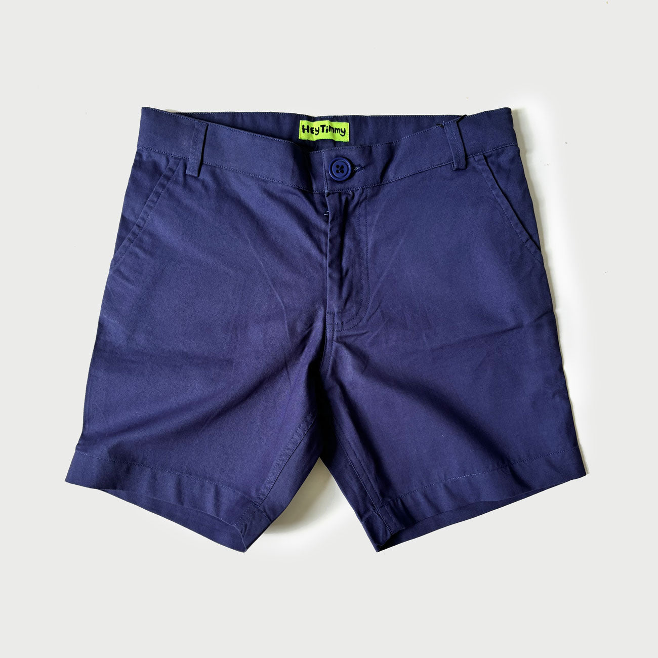 Flat lay of navy blue chino shorts for boys