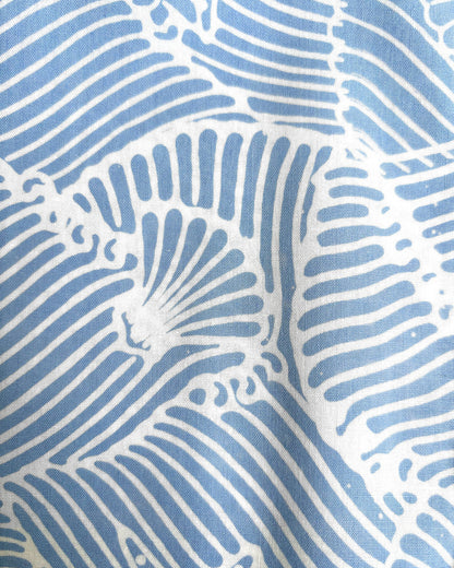 Close-up of batik seashell pattern in blue and white