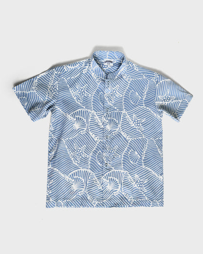 Blue batik seashell shirt on a white background