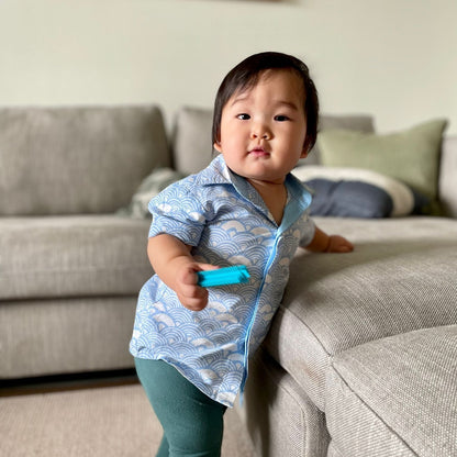 Baby wearing light blue batik shirt