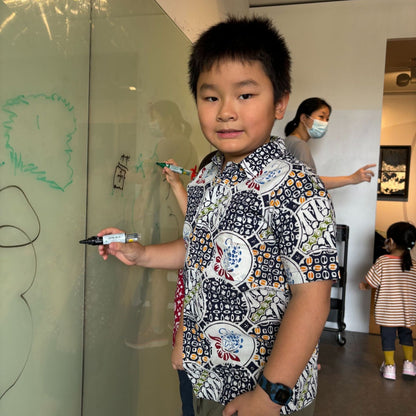 Model wearing Kamma batik shirt