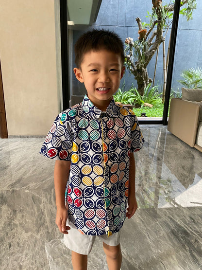 Model wearing colorful kawung batik shirt